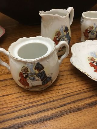 Antique BUSTER BROWN Porcelain Child ' s Tea Set GERMANY 13 Piece Various Designs 4