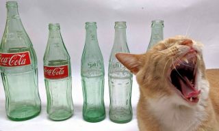 5 Vintage Coca Cola Bottles Greenish Tint 1 - 32 Oz.  1 - 16.  9 Oz And 3 - 10 Oz.