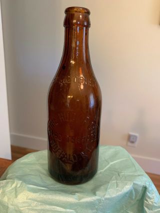 The Hudor Co.  Buffalo N.  Y.  54 - 60 Terrace 7.  5 Inch Amber Bottle