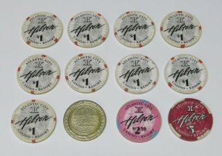 12 Hilton Ac Casino Chips (10) $1 Chips,  (1) $2.  50 Chip & (1) $5 Chip