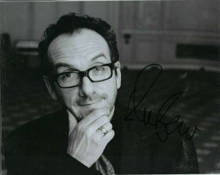 Elvis Costello Autographed 8 X 10 Black & White Glossy Photo.