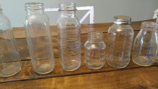 Set of (14) vintage glass bottles.  Each Baby bottle is different. 3