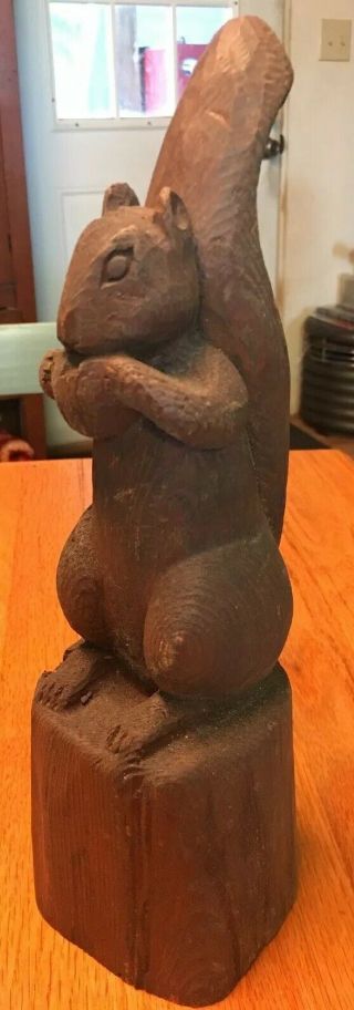 Hand Carved Wooden Squirrel Sitting On Wood Base