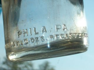 clear embossed glass 1 pint 14 FLD.  oz.  bottling Co.  Philadelphia,  Pa. 6