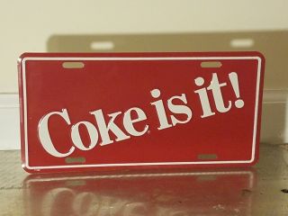 Vintage Metal Embossed Coca Cola Coke Is It License Plate Sign Advertising