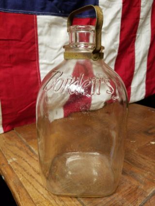 Antique Embossed Bordens Gallon Size Milk Bottle With Metal Handel