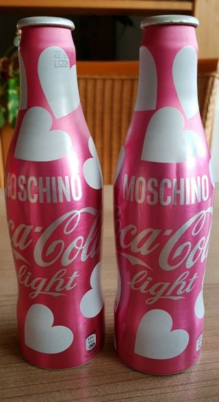 Coca Cola Alu Bottles From Switzerland.  Moschino Designer 2 Empty Bottles