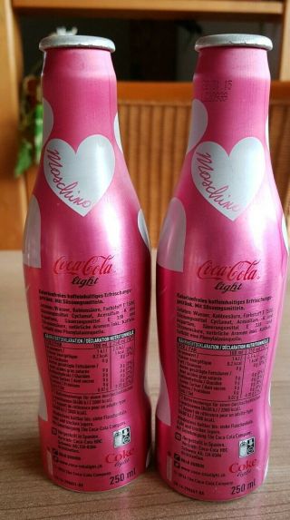 coca cola alu bottles from Switzerland.  Moschino Designer 2 empty bottles 2
