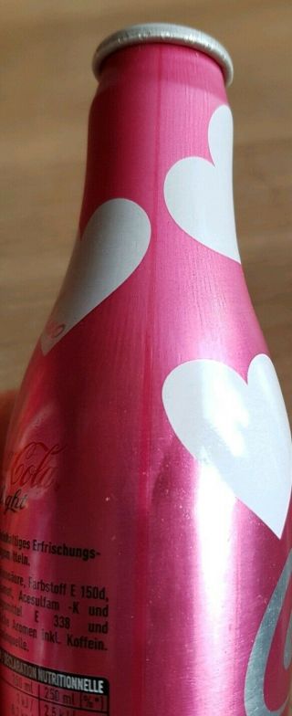 coca cola alu bottles from Switzerland.  Moschino Designer 2 empty bottles 3