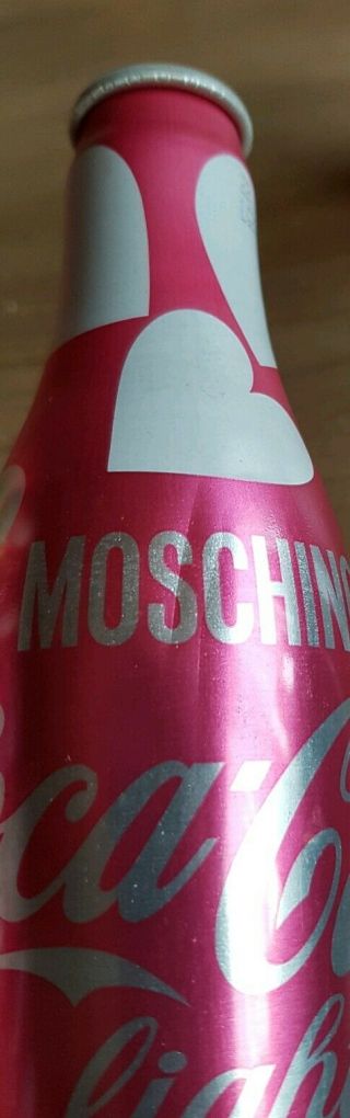 coca cola alu bottles from Switzerland.  Moschino Designer 2 empty bottles 4