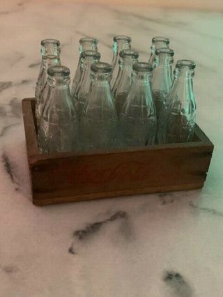 Antique miniature glass Coca Cola Coke bottles in wood crate 8