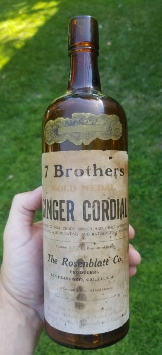 Antique / Vintage Whiskey Bottle 7 Brothers Ginger Cordial 95 Full Label Amber
