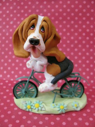 Handsculpted Tri Basset Hound Bicycle Ride Figurine