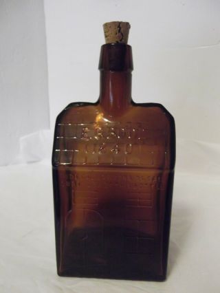 E G Booz (1840) Log Cabin Amber Bottle Embossed With Cork Empty