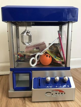 “the Claw” Mini Claw Machine.  With 22 Back To School Supplies.  Lights And Music.