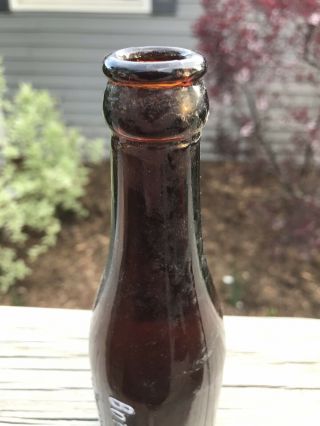 CLINTON,  IOWA 1910’s Vertical Embossed Iowa Bottling Co.  Amber Soda Bottle 5