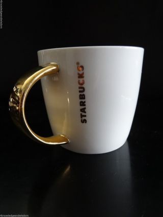 Starbucks 2015 White Ceramic Coffee Mug Gold Handle & Vertical Letters 14 Oz Cup