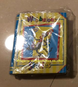 Dr.  Suess Wubbulous Stories Yellow/blue Collectible Tin Book (empty)