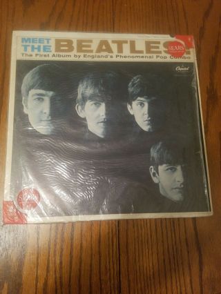 Meet The Beatles In Sears Shrink Wrap.