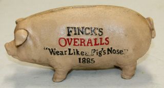 HEAVY CAST IRON FINCKS OVERALLS PIG HOG PIGGY BANK WEAR LIKE A PIGS NOSE 1885 2