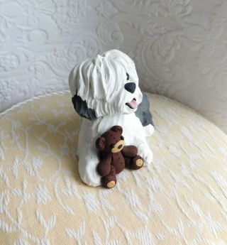Old English Sheepdog with Teddy Bear Clay Sculpture by Raquel at theWRC 2