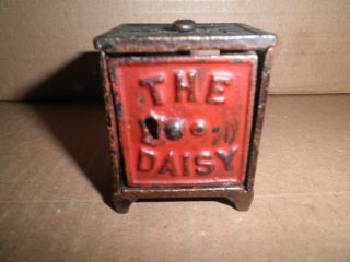 Wonderful Old Small Cast Iron The Daisy Safe Still Penny Bank C.  1899