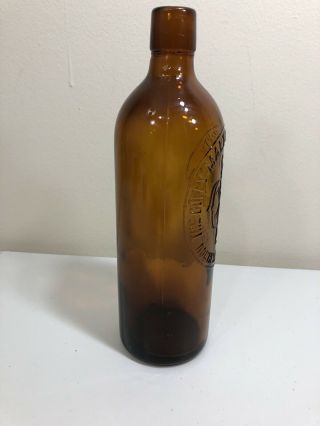 ANTIQUE 1886 EMBOSSED DUFFY MALT WHISKEY BOTTLE WITH LABEL OVER TEN INCHES TALL 5