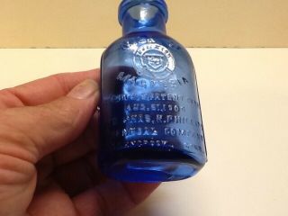 Small Fully Embossed Cobalt Blue Milk Of Magnesia Bottle. 2