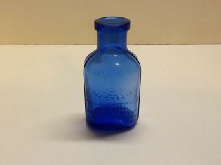Small Fully Embossed Cobalt Blue Milk Of Magnesia Bottle. 5