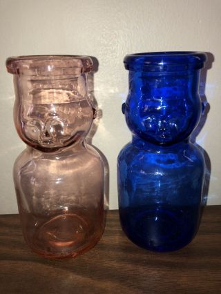 2 Vtg 1 Pink & 1 Cobalt Blue Glass Milk Bottles 1/2 Pint Baby Face Glass Bottle