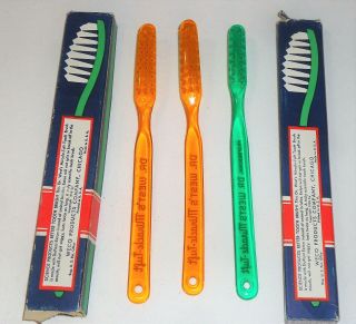 3 Vintage Dr West ' s Miracle Tuft Toothbrush ' s two Orange one Green 3