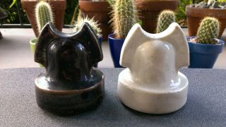 TWO ROMAN HELMET CABLE TOP PORCELAIN INSULATORS.  GLOSS WHITE AND MOLTEN COLORED 2