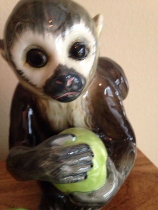 Ceramic Monkey Holding Green Ball