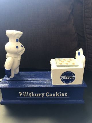 Vintage Pillsbury Doughboy Cast Iron Mechanical Coin Bank