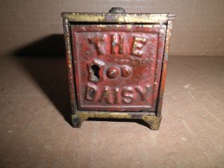 Neat Old Tiny Cast Iron The Daisy Safe Still Penny Bank C.  1899
