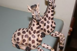 Set Of 2 Resin Giraffe Figurines With Movable Legs.