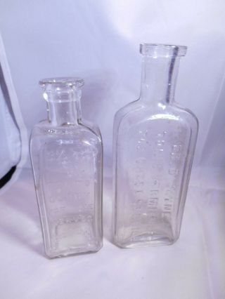 2 Embossed Antique Medicine Bottles - Parto Glory & Dr.  D Jayne 