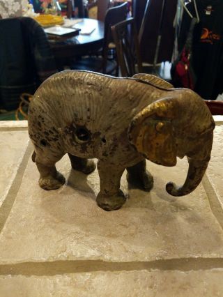 Vintage Cast Iron Metal Elephant Coin Bank 4 3/4 Inches Tall And 7 Inches Long.