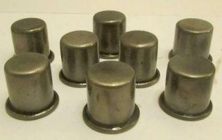 A Set Of 8 Metal Oil Caps For Master Oil Bottles