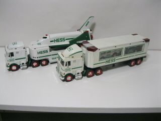 Hess Trucks 1997 & 1999 No Boxes.  Only Shelf Displayed