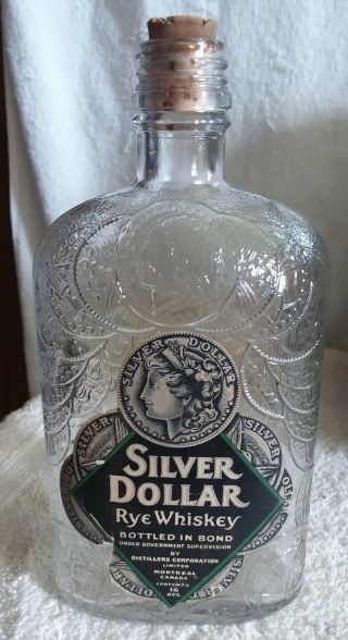 Vintage Silver Dollar Rye Whiskey 16 Oz.  Embossed Bottle W/ Paper Label