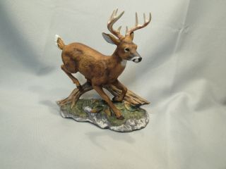 Deer Jumping A Log,  Homco Masterpiece Figurine 7 " Tall.  1986 Vintage.