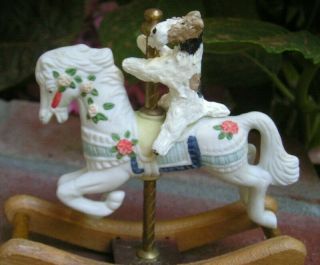 Wire Fox Terrier On A Carousel Horse