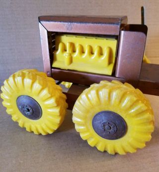 VINTAGE STRUCTO ROAD GRADER WITH YELLOW WHEELS AND ENGINE 4