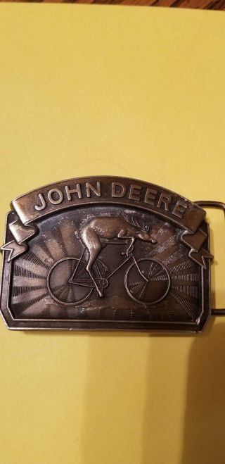 John Deere 1988 Belt Buckle " Deer Riding On Bike " Rare Deere & Company