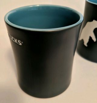 Starbucks 2012 Coffee Mug Yukon Polar Bear Set of 2.  Bone China 16 oz Cups Black 8