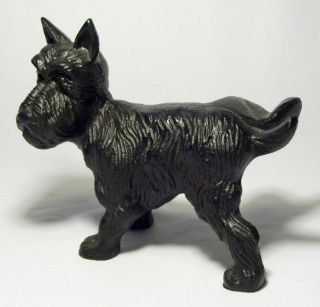 Whimsical Black Cast Iron Scottish Terrier Dog Lifting Rear Leg Doorstop