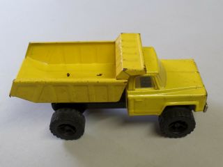 Vintage Pressed Steel Chevy Dump Truck Yellow Made in Japan Approx 8 1/2 