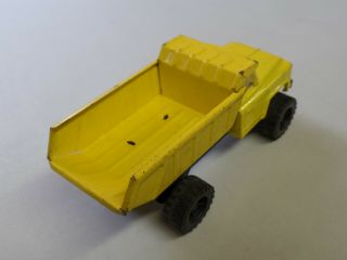 Vintage Pressed Steel Chevy Dump Truck Yellow Made in Japan Approx 8 1/2 