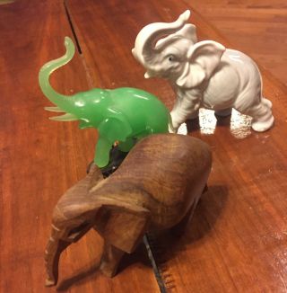 Three SMALL ELEPHANTS FIGURINES.  Wood,  Porcelain,  And Green Jade On Base 2